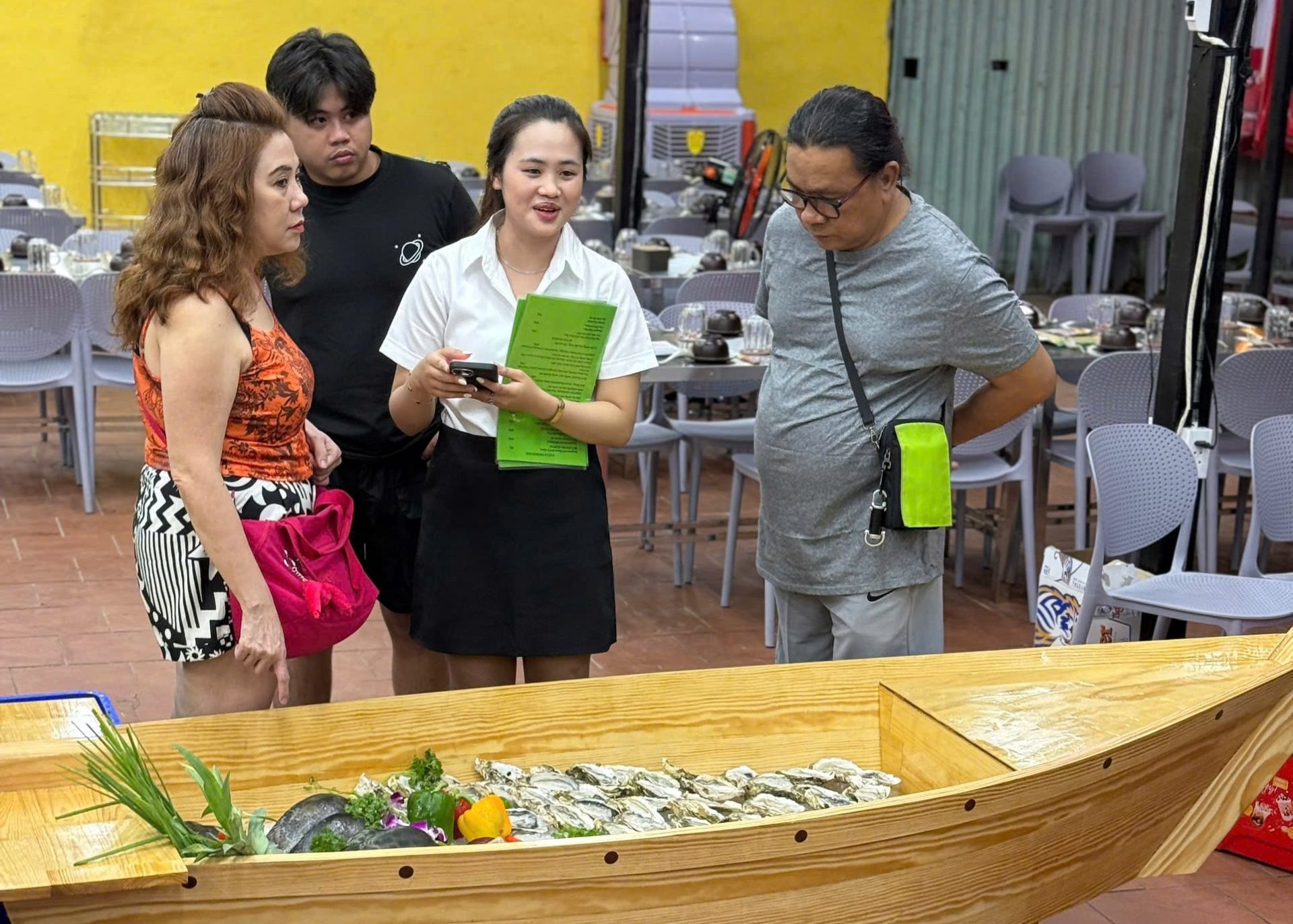 Customers select seafood dishes to be prepared