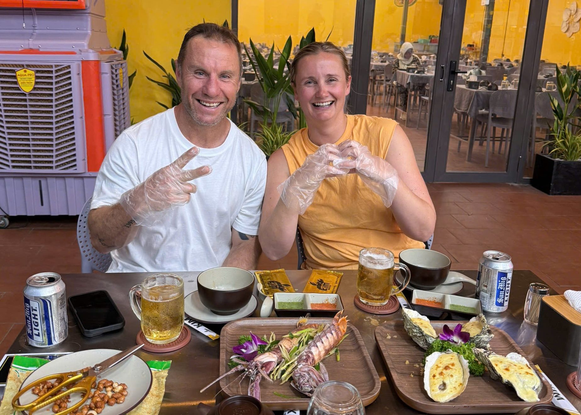 Tourists enjoying meals at a familiar seafood restaurant of locals